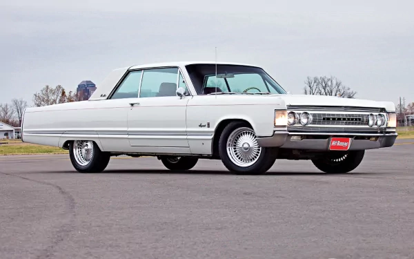 1967 Chrysler Imperial Crown Coupe showcased in high definition, captured as a sleek vintage vehicle on an open road for a PC desktop wallpaper.