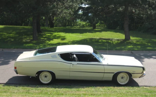 HD PC desktop wallpaper featuring a classic white Ford Torino GT parked on a street with green trees in the background.