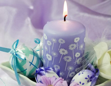 A serene Easter scene featuring a lavender candle surrounded by colorful decorated eggs, creating a festive and soothing ambiance in this 4K Ultra HD wallpaper.