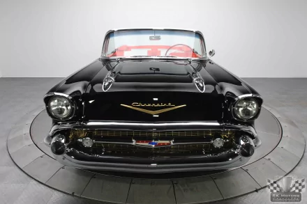 Front view of a black 1957 Chevrolet Belair Convertible showcased as an HD PC desktop wallpaper and background.