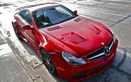 A striking red Mercedes-Benz SL65 captured in high definition, showcased as a sleek PC desktop wallpaper and background.
