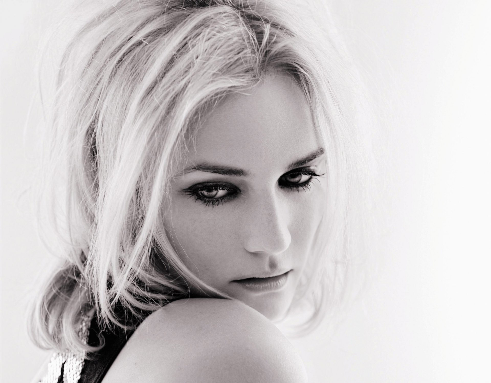 Black and white portrait of celebrity Diane Kruger, showcasing her striking features and intense gaze, designed as a high-definition desktop wallpaper.