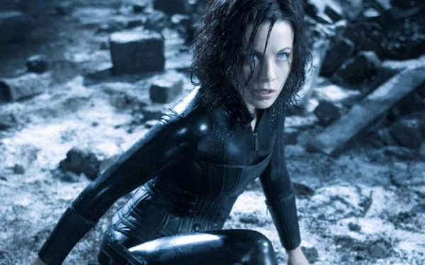 HD PC desktop wallpaper featuring a scene from the movie Underworld: Evolution, showing the protagonist in a dark, snowy, and ruined environment.