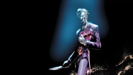 HD PC desktop wallpaper featuring the Joker from Batman: Death of the Family comic, illuminated in a dark, eerie spotlight holding a knife.