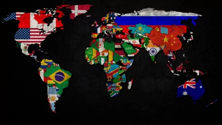 HD desktop wallpaper featuring a world map with each country represented by its colorful flag against a dark background.