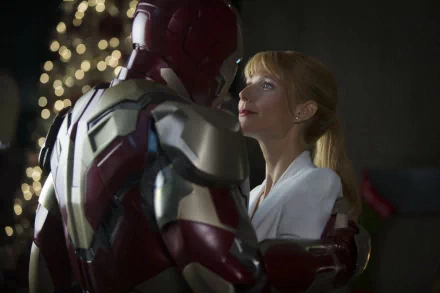 HD PC desktop wallpaper from the movie Iron Man 3, featuring Iron Man in suit facing a woman with a softly lit background.