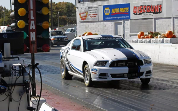 White Ford Mustang Cobra Jet twin-turbo launching on a drag strip, 2K Quad HD PC desktop wallpaper/background.