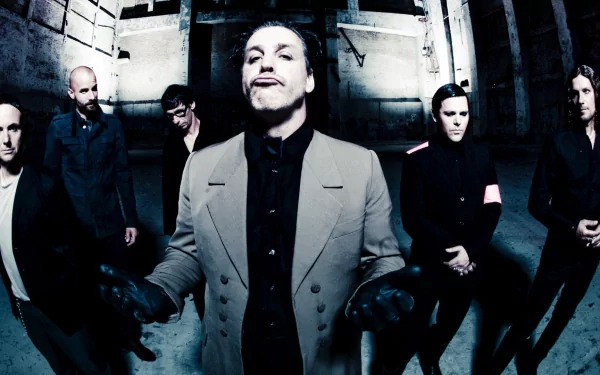 HD PC desktop wallpaper featuring the German industrial metal band Rammstein posing in a dark, urban setting, highlighting their intense and dramatic style.