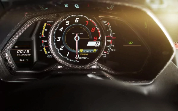 Close-up of the dashboard of a Lamborghini Aventador LP 700-4, showcasing the speedometer and various gauges, set against a sleek backdrop for a dynamic HD desktop wallpaper.