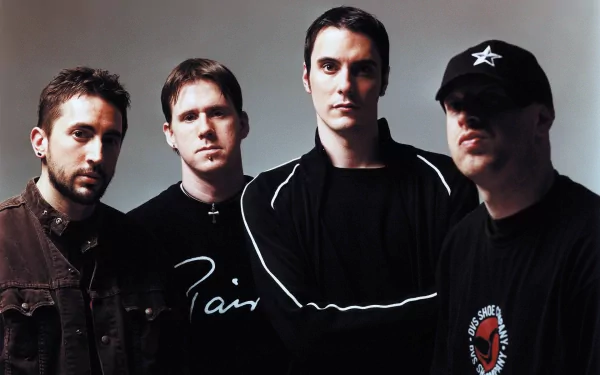 A high-definition PC desktop wallpaper featuring the band Breaking Benjamin, showcasing the four members in a striking, moody setting.