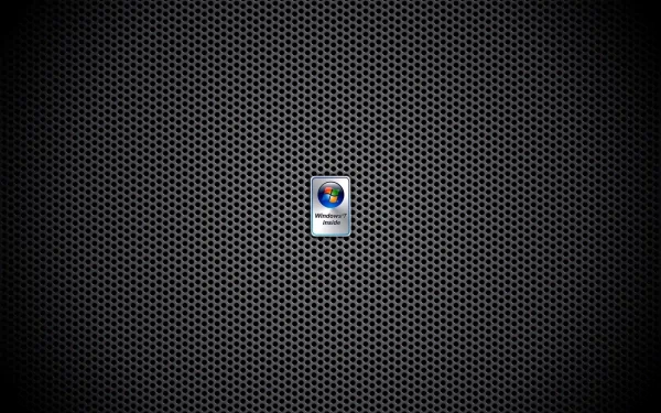 HD desktop wallpaper featuring a dark, textured metallic grid background with a centered Windows 7 logo, highlighting technology and classic PC design.
