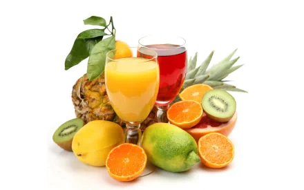 A vibrant arrangement of fresh fruit, including oranges, kiwis, and a pineapple, alongside glasses of yellow and red juice, creates a colorful and appetizing HD desktop wallpaper.