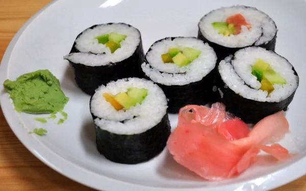 HD PC desktop wallpaper featuring a close-up of sushi rolls served with wasabi and pickled ginger on a white plate.