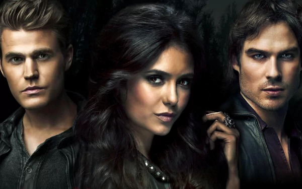 HD wallpaper featuring characters from the TV show The Vampire Diaries, showcasing a dramatic trio with a dark and captivating background.