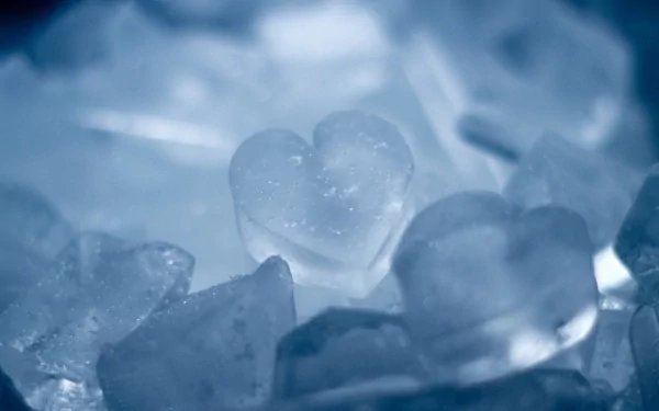 Artistic HD PC desktop wallpaper featuring translucent heart-shaped objects in soft blue tones, creating a calming and visually appealing background.