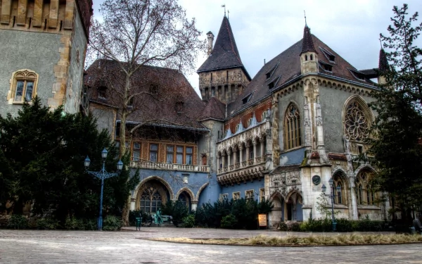 A majestic, man-made building features ornate architecture and tall towers, set against a cloudy sky—an ideal HD desktop wallpaper and background showcasing grandeur and history.