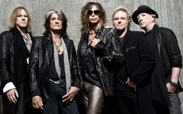 A high-definition wallpaper featuring the iconic rock band Aerosmith, with Steven Tyler and fellow members posing in stylish attire against a textured backdrop.