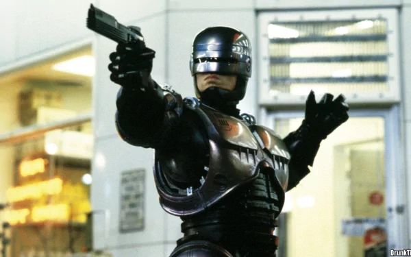 HD PC desktop wallpaper featuring RoboCop from the 1987 movie, showcasing the iconic armored figure aiming a weapon in an urban setting.