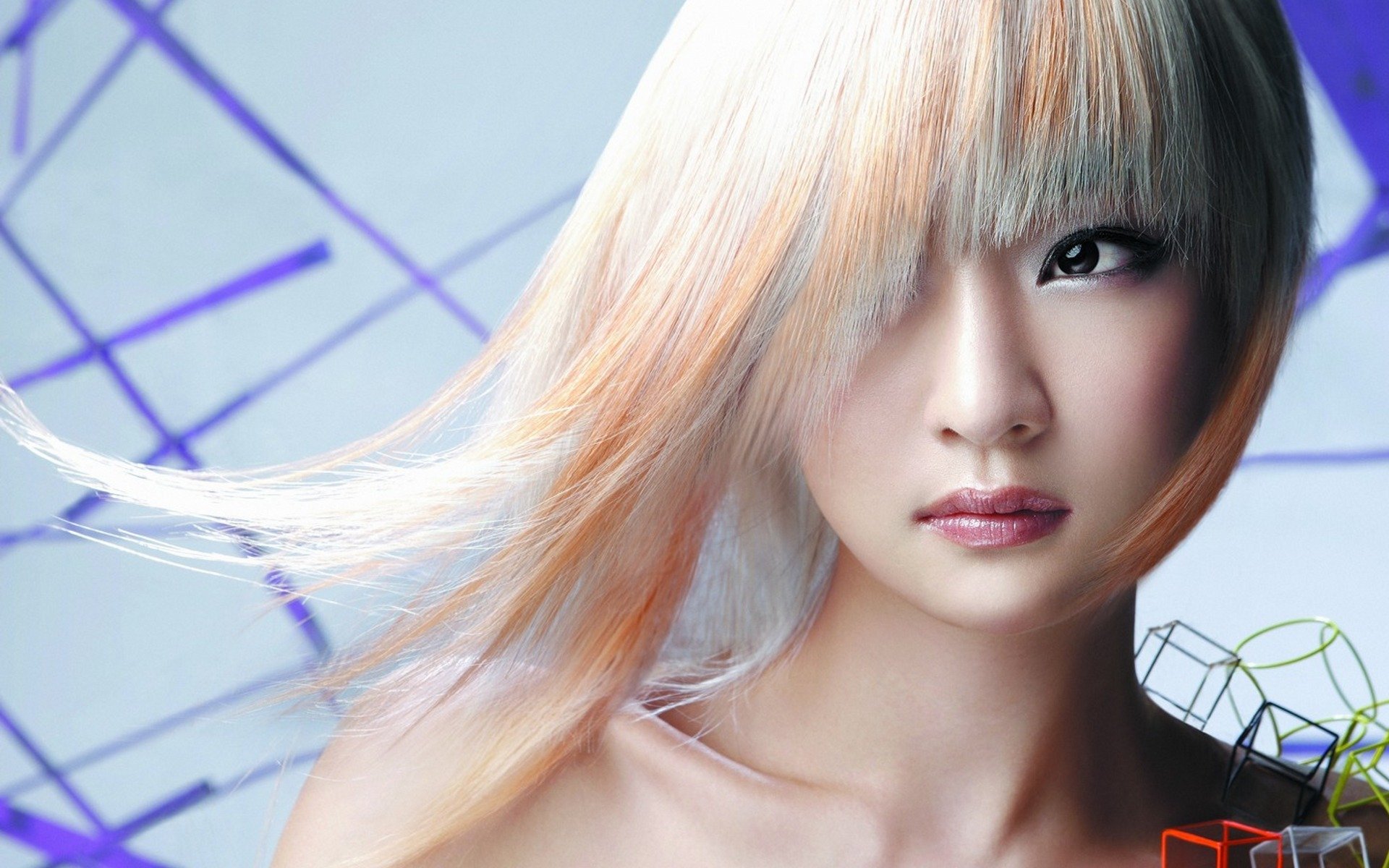 HD desktop wallpaper featuring a woman with pastel-colored hair against a geometric background. The close-up showcases her serene face with a modern and artistic touch.