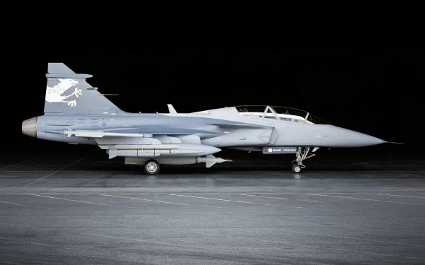 HD desktop wallpaper of a Saab JAS 39 Gripen military fighter jet displayed in a neutral, dark background.