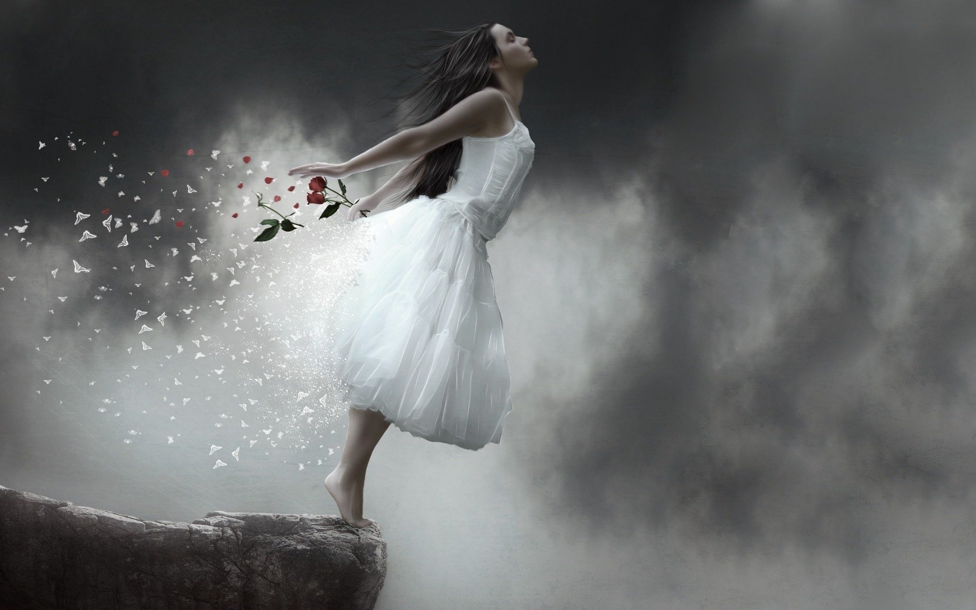 A fantasy-themed HD wallpaper featuring a woman in a flowing white dress, standing on a cliff, with petals and a rose swirling around her against a dramatic, cloudy backdrop.