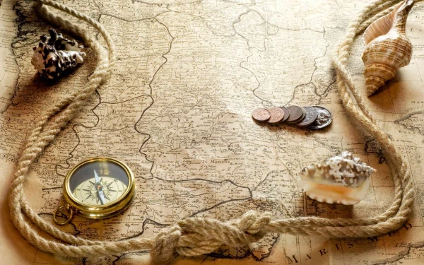 Misc,map: HD PC Desktop Wallpaper and Background showing an antique sea map with compass, rope, seashells and coins, sepia tones evoking nautical exploration.