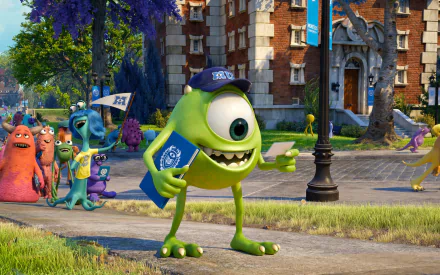 Mike Wazowski stands in front of Monsters University, holding a clipboard and smiling, surrounded by classmates. This vibrant HD image captures a lively moment from the movie.