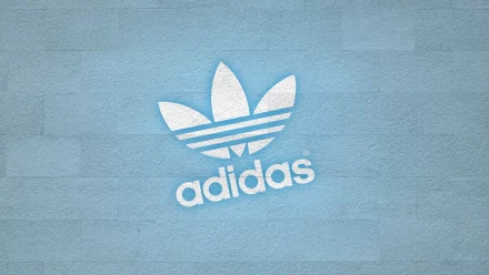 A high-definition desktop wallpaper featuring the iconic Adidas logo against a textured light blue background, showcasing a modern and stylish design.