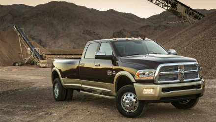 HD desktop wallpaper featuring a Dodge Ram 3500 truck parked at a construction site with mountains in the background.
