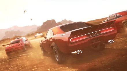 HD PC desktop wallpaper from the video game The Crew: red muscle cars kicking up dust as they race across a sunlit desert landscape.
