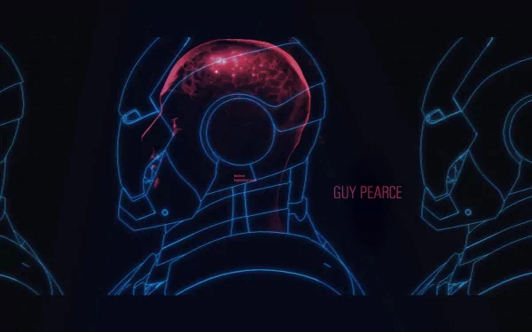 An HD desktop wallpaper featuring a stylized silhouette of Iron Man's helmet, showcasing a glowing red brain interface, with the name Guy Pearce prominently displayed.