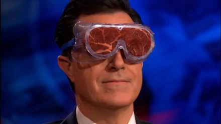 Stephen Colbert wearing funny meat goggles on The Colbert Report, formatted as an HD desktop wallpaper.