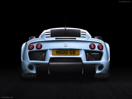 HD PC desktop wallpaper: rear view of a silver Noble M600 sports vehicle against a black background.