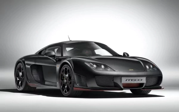 HD PC desktop wallpaper featuring a sleek black Noble M600 sports car against a simple, light background.