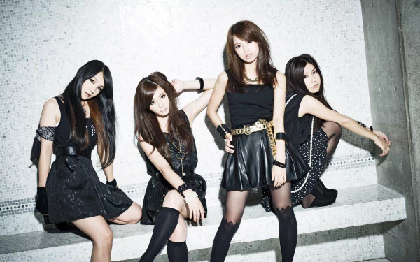 HD PC desktop wallpaper (music, tagged Scandal): four women in coordinated black outfits posing on concrete steps against a light tiled wall.