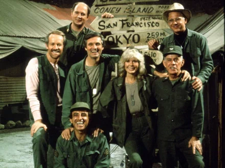 A nostalgic scene from the TV show M*A*S*H featuring characters including Hawkeye, Margaret Houlihan, and Maxwell Klinger, capturing the camaraderie of the series' cast.