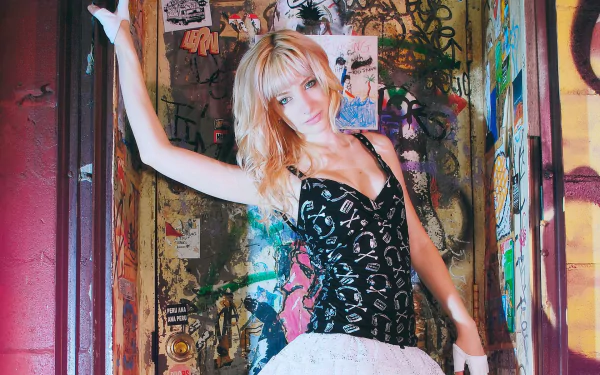 HD PC desktop wallpaper featuring celebrity Susan Coffey posing against a vibrant, graffiti-covered urban background.