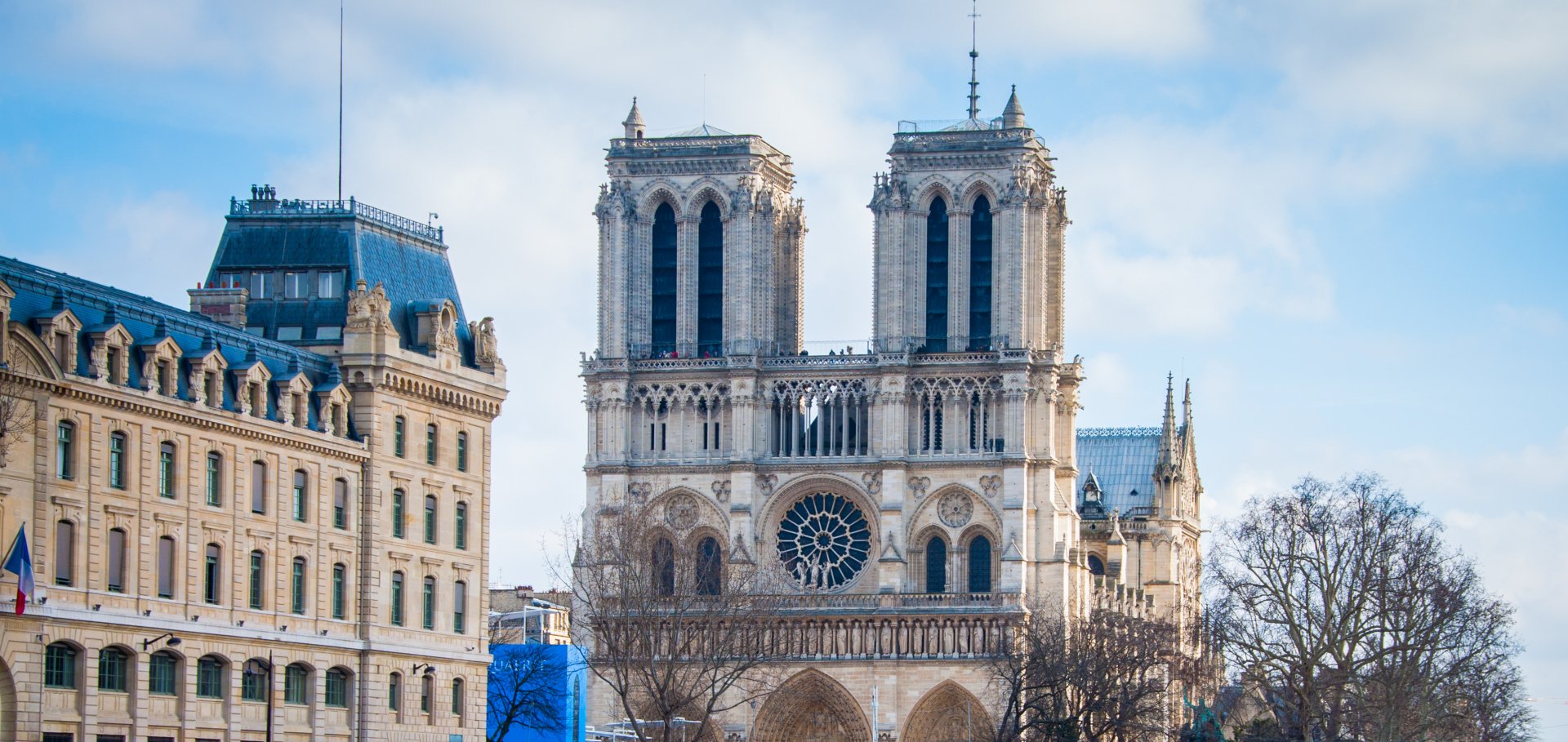 HD desktop wallpaper featuring the iconic Notre-Dame de Paris cathedral, a masterpiece of French religious architecture in the heart of Paris, France.