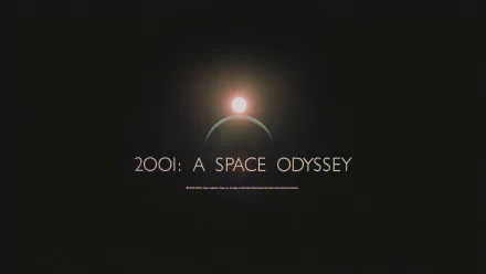 HD desktop wallpaper featuring the iconic title 2001: A Space Odyssey against a cosmic background with a sun and curvature of a planet.