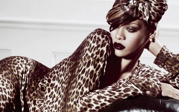 HD desktop wallpaper of Rihanna in a leopard print outfit and headwrap, with bold makeup, representing her music persona.