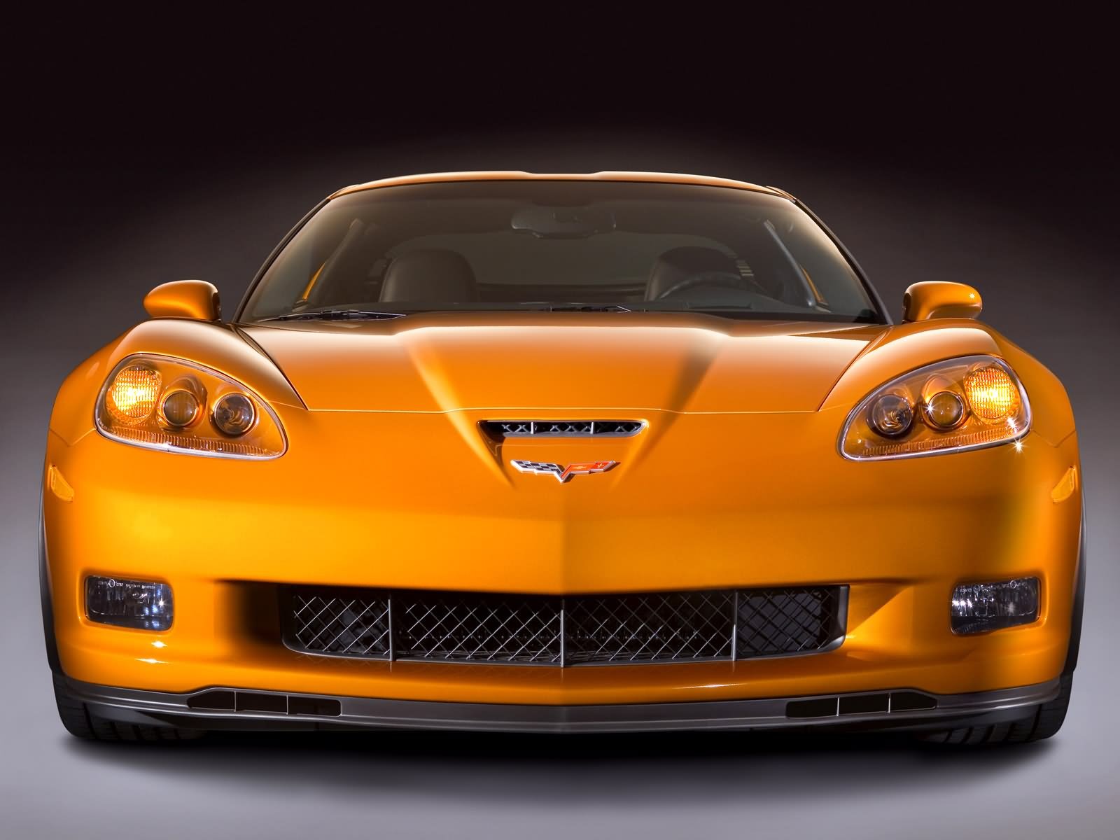 Front view of an orange Chevrolet Corvette displayed as an HD PC desktop wallpaper and background.