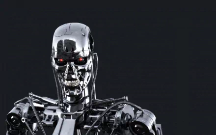 Close-up of the T-800 from the movie The Terminator, featuring a sleek metallic design and glowing red eyes, set against a dark background. High-definition wallpaper for fans.