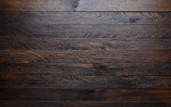 Artistic wooden texture featuring rich, dark tones, creating a warm and inviting atmosphere. This high-definition image serves as an attractive desktop wallpaper and background.
