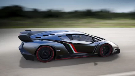 HD desktop wallpaper showing a sleek Lamborghini Veneno speeding on a flat road with a blurred background. The vehicle's futuristic design and bold colors highlight its high-performance nature.