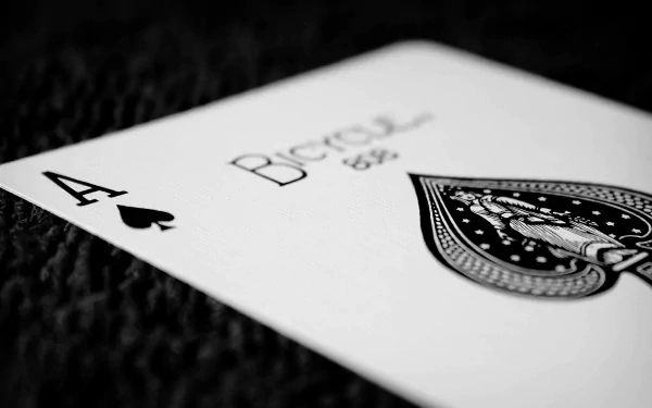 A close-up of an Ace of Spades playing card, featuring intricate designs, captured in high definition. This image serves as an engaging PC desktop wallpaper and background.