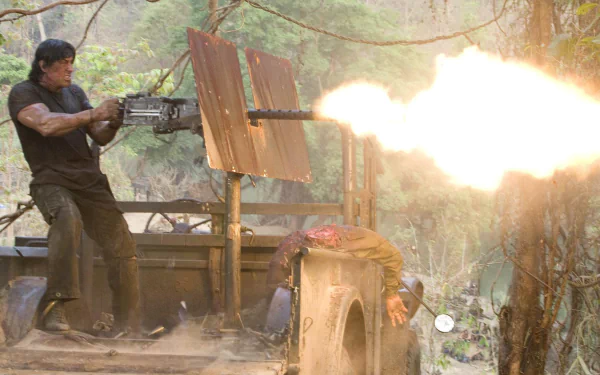 A high-definition wallpaper featuring a scene from the movie Rambo, depicting an intense action moment with the protagonist firing a heavy machine gun amidst a jungle setting.