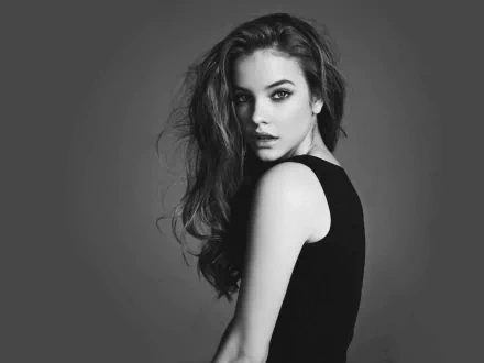A striking black and white HD desktop wallpaper featuring celebrity Barbara Palvin, showcasing her captivating pose and expressive gaze.