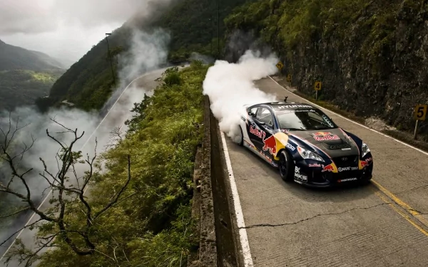 HD desktop wallpaper featuring a Hyundai Genesis drifting on a mountain road, surrounded by lush greenery and misty hills.