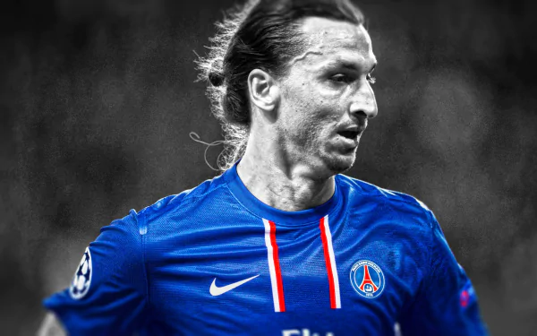 HD desktop wallpaper of Zlatan Ibrahimović in a Paris Saint-Germain jersey, captured in a dynamic sports moment in black and blue tones.