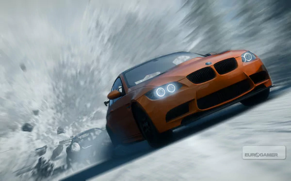 HD PC desktop wallpaper from the video game Need For Speed: The Run featuring an orange sports car drifting sharply on a snowy mountain road.